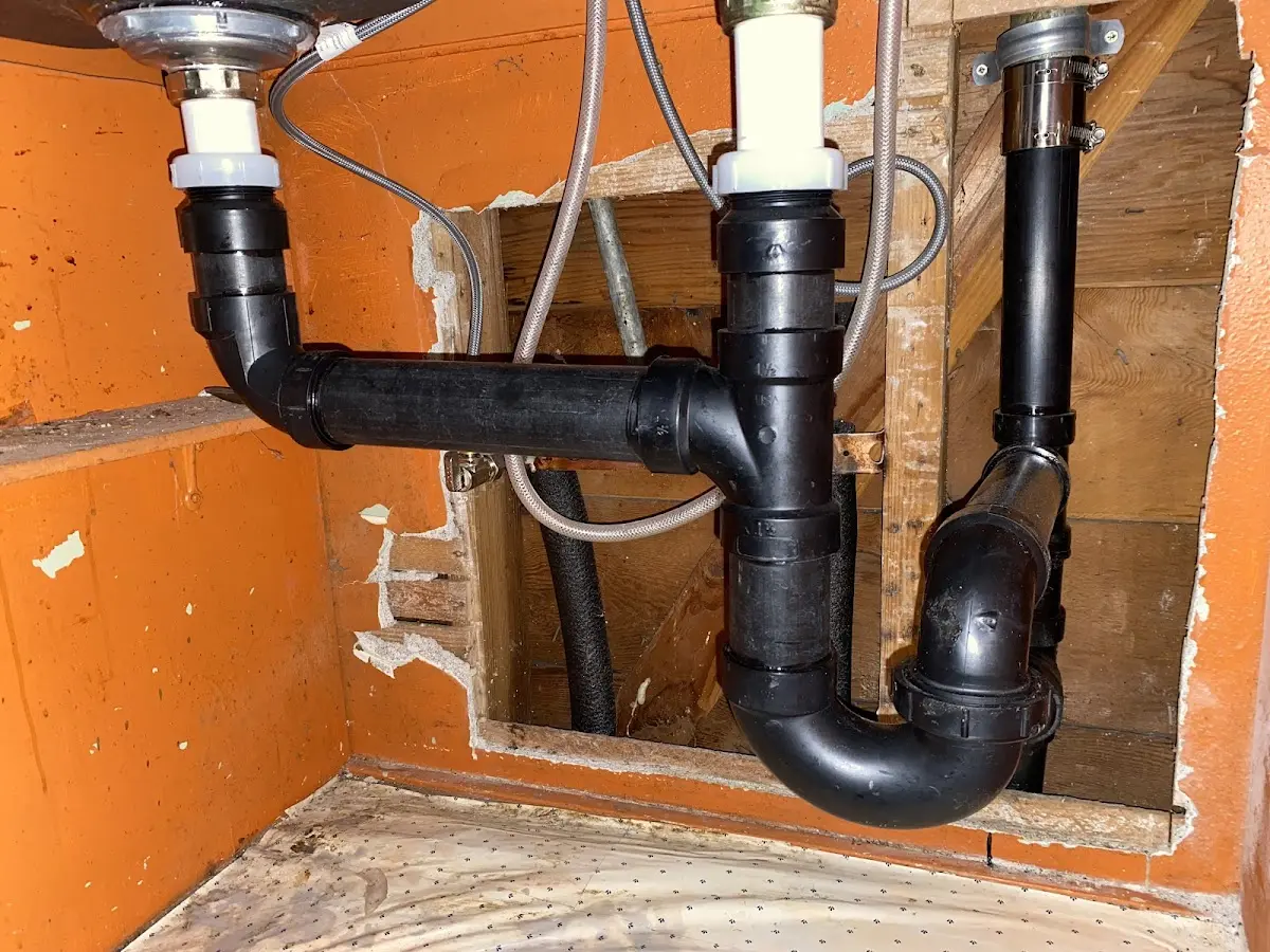 Professional Garbage Disposal Repair equipment and tools on the job in Olympia